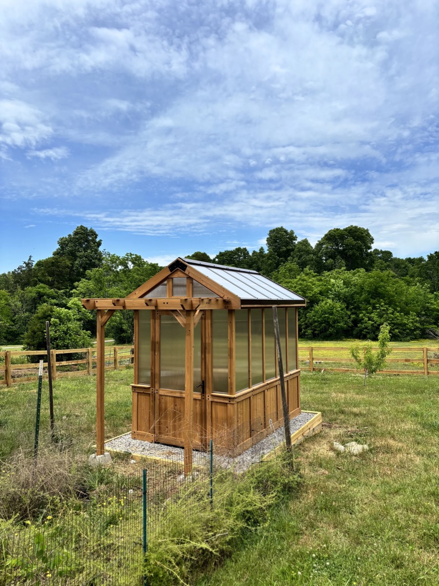 Custom cedar and polycarbonate greenhouse built by Henning Construction in Middle Tennessee