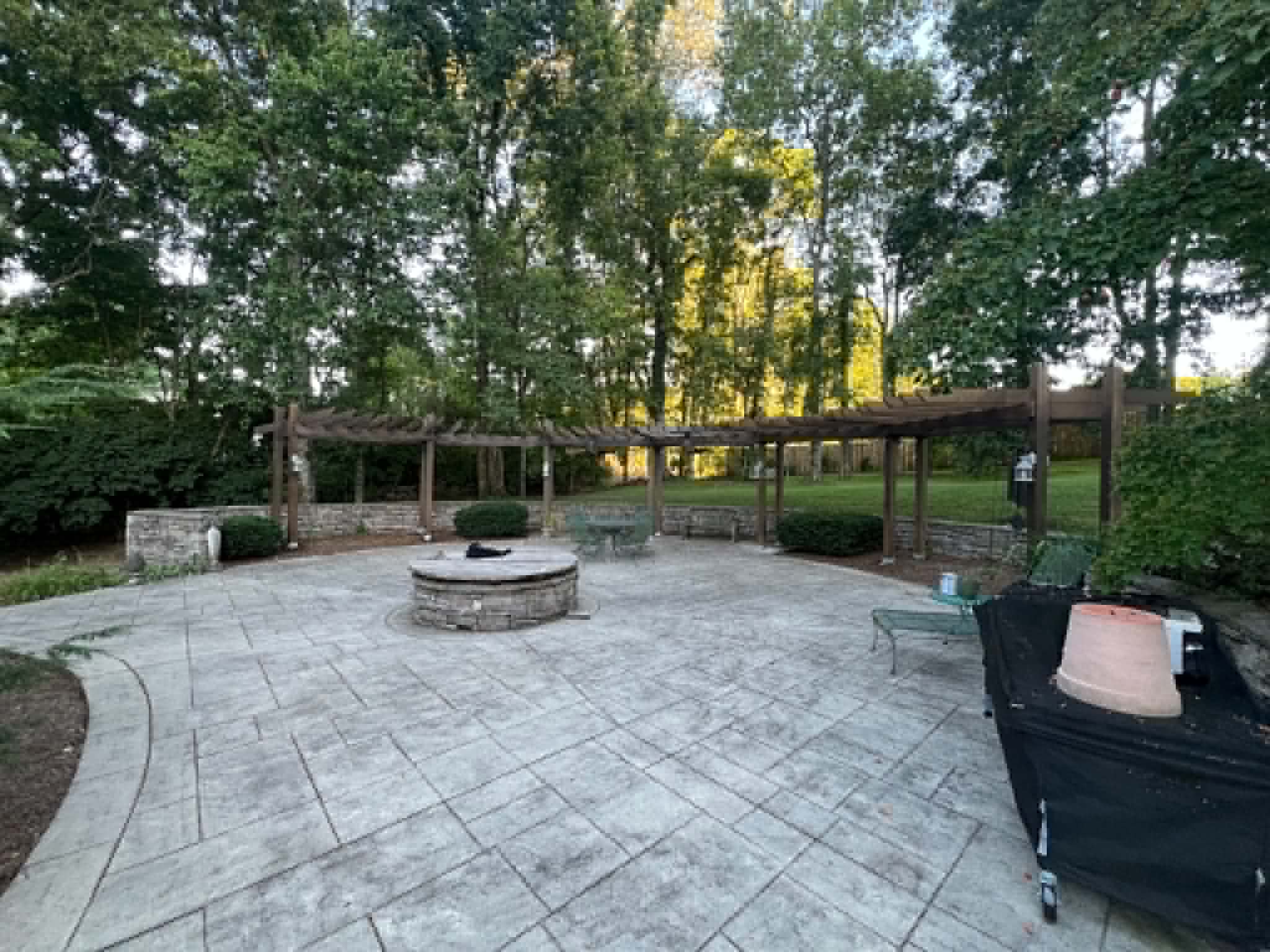 Stamped concrete patio with stone fire pit surround built by Henning Construction in Middle Tennessee